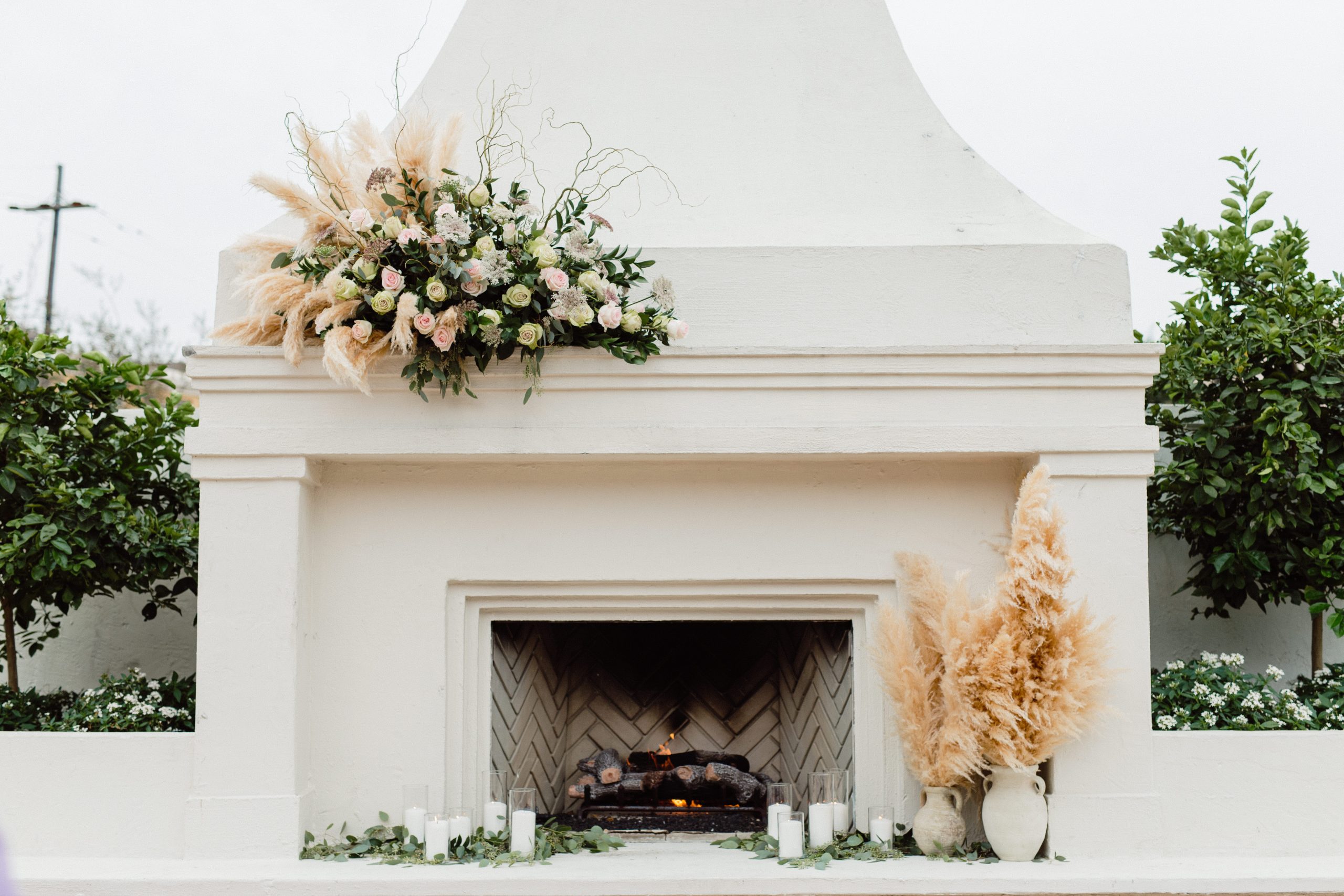 Boho Outdoor Wedding Ceremony Pampas Grass Flower Arrangements At Il Mercato Fireplace Kristen Souleau Photography 172 Scaled