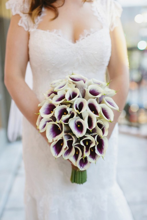 Modern Cascading Wedding Bouquet Of Picasso Call Lilies
