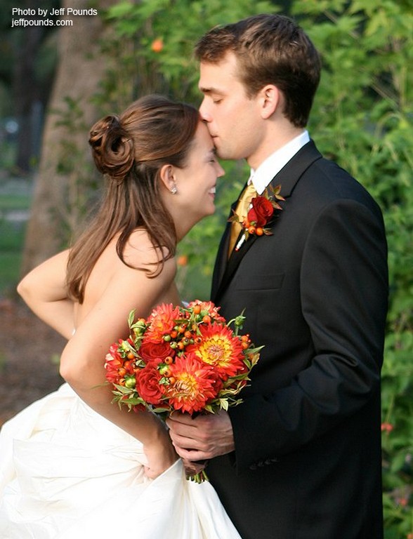 Romantic Wedding Couple With Bouquet And Boutonnier